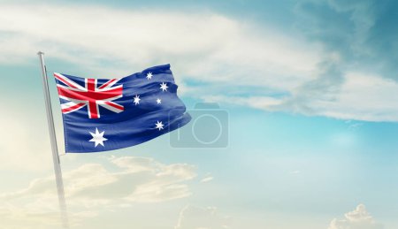 Foto de Australia ondeando bandera en hermoso cielo. - Imagen libre de derechos