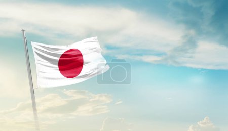 Téléchargez les photos : Japan waving flag in beautiful sky. - en image libre de droit