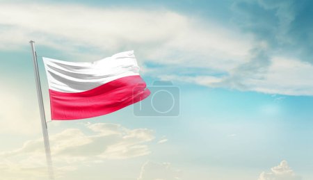 Foto de Poland waving flag in beautiful sky. - Imagen libre de derechos