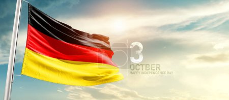 Téléchargez les photos : Germany waving flag in beautiful sky with sun - en image libre de droit