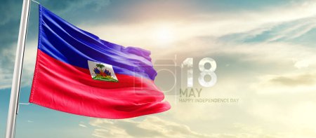 Téléchargez les photos : Haiti waving flag in beautiful sky with sun - en image libre de droit