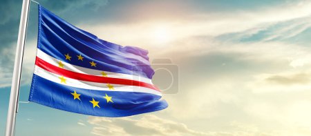 Téléchargez les photos : Cabo Verde waving flag in beautiful sky with sun - en image libre de droit