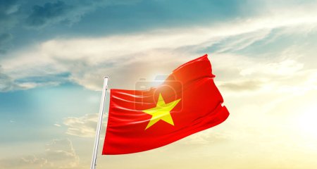 Foto de Vietnam waving flag in beautiful sky with sun - Imagen libre de derechos