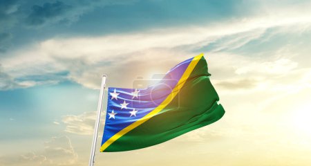 Foto de Solomon Islands waving flag in beautiful sky with sun - Imagen libre de derechos