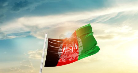 Téléchargez les photos : Afghanistan waving flag in beautiful sky with sun - en image libre de droit