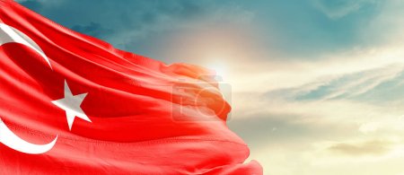 Photo for Turkey waving flag in beautiful sky with sun - Royalty Free Image