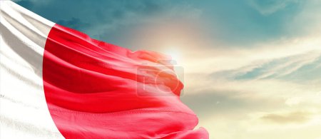 Photo for Malta waving flag in beautiful sky with sun - Royalty Free Image