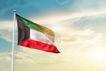 Foto de Kuwait waving flag in beautiful sky with sun - Imagen libre de derechos