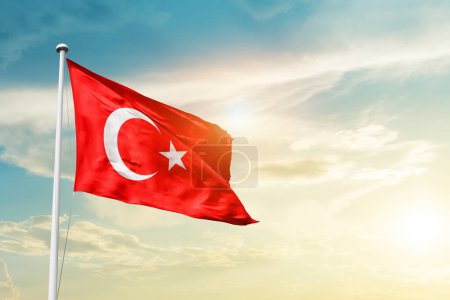 Photo for Turkey waving flag in beautiful sky with sun - Royalty Free Image