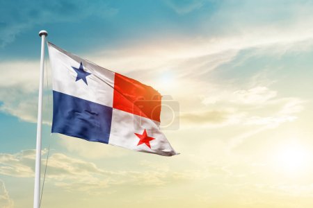 Panama waving flag in beautiful sky with sun