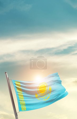 Foto de Kazakhstan waving flag in beautiful sky with sun - Imagen libre de derechos