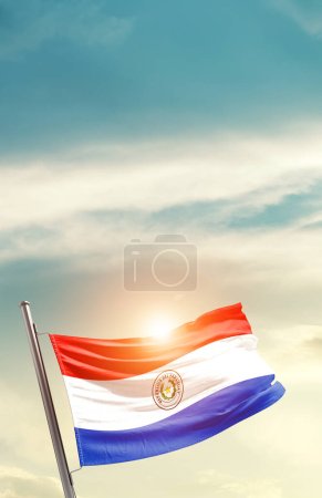Photo for Paraguay waving flag in beautiful sky with sun - Royalty Free Image