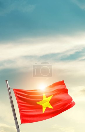 Photo for Vietnam waving flag in beautiful sky with sun - Royalty Free Image