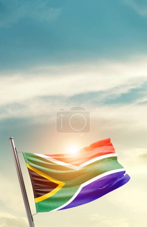 Photo for South Africa waving flag in beautiful sky with sun - Royalty Free Image