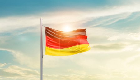 Téléchargez les photos : Germany waving flag in beautiful sky with sun - en image libre de droit