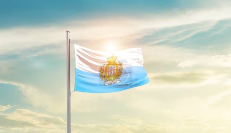 Téléchargez les photos : San Marino waving flag in beautiful sky with sun - en image libre de droit