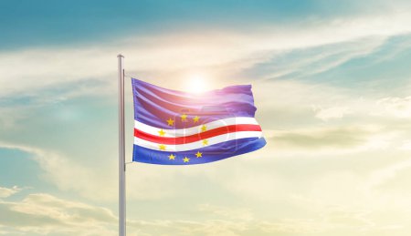 Photo for Cabo Verde waving flag in beautiful sky with sun - Royalty Free Image