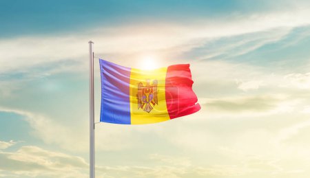 Foto de Moldova waving flag in beautiful sky with sun - Imagen libre de derechos