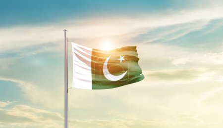 Photo for Pakistan waving flag in beautiful sky with sun - Royalty Free Image