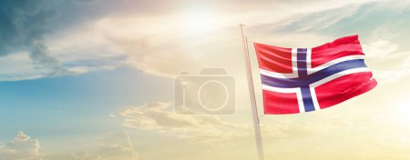 Photo for Norway waving flag in beautiful sky with sun - Royalty Free Image