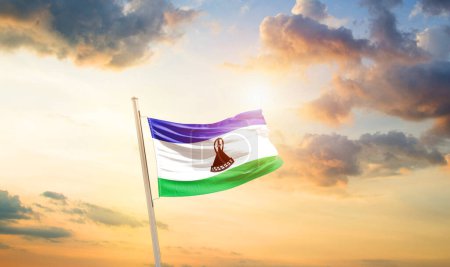 Photo for Lesotho waving flag in beautiful sky with clouds and sun - Royalty Free Image