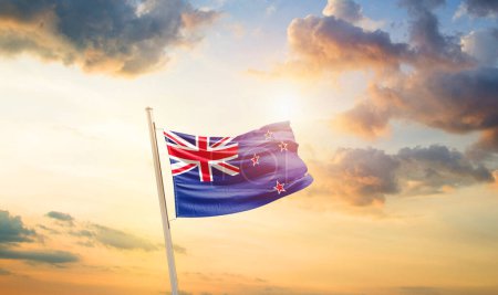 Photo for New Zealand waving flag in beautiful sky with clouds and sun - Royalty Free Image