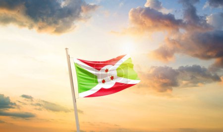 Téléchargez les photos : Drapeau du Burundi dans un ciel magnifique avec nuages et soleil - en image libre de droit