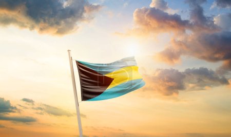 Bahamas waving flag in beautiful sky with clouds and sun