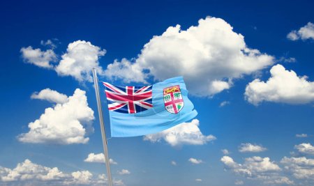 Photo for Fiji waving flag in beautiful sky with clouds - Royalty Free Image