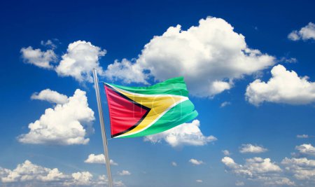 Foto de Guyana ondeando bandera en hermoso cielo con nubes - Imagen libre de derechos