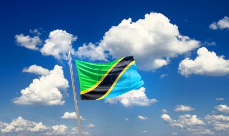 Téléchargez les photos : Tanzanie agitant le drapeau dans un ciel magnifique avec des nuages - en image libre de droit