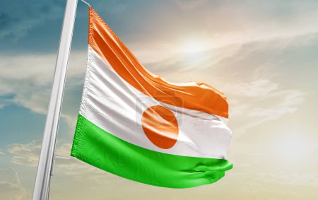 Téléchargez les photos : Niger waving flag against sky - en image libre de droit
