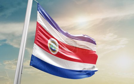 Photo for Costa Rica waving flag against sky - Royalty Free Image