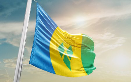 Photo for Saint Vincent and the Grenadines waving flag against sky - Royalty Free Image
