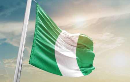 Téléchargez les photos : Nigeria waving flag against sky - en image libre de droit