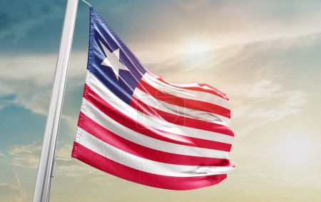 Téléchargez les photos : Liberia waving flag against sky - en image libre de droit