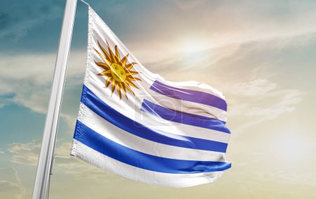 Foto de Uruguay waving flag against sky - Imagen libre de derechos