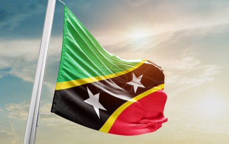 Foto de Saint Kitts and Nevis waving flag against sky - Imagen libre de derechos