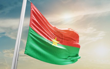 Téléchargez les photos : Burkina Faso waving flag against sky - en image libre de droit