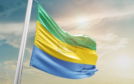 Téléchargez les photos : Gabon agitant le drapeau contre le ciel - en image libre de droit