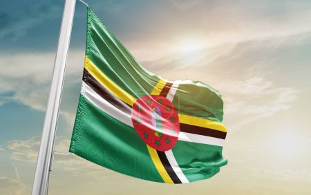 Foto de Dominica waving flag against sky - Imagen libre de derechos