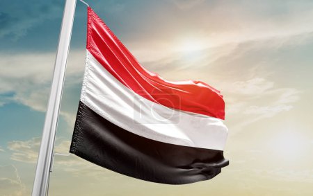 Téléchargez les photos : Yemen waving flag against sky - en image libre de droit