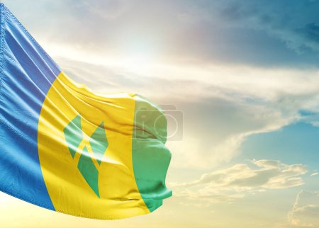 Photo for Saint Vincent and the Grenadines flag against sky - Royalty Free Image