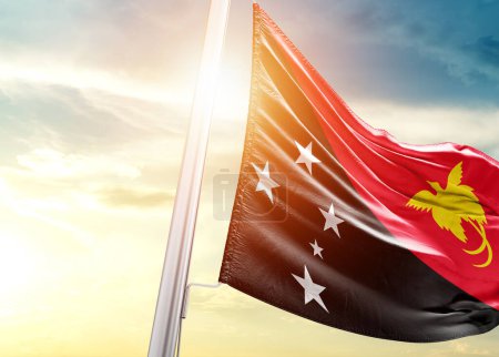 Photo for Papua New Guinea flag against sky with sun - Royalty Free Image