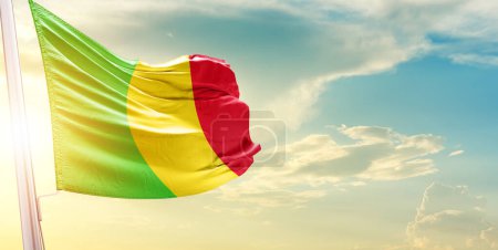 Photo for Mali flag against sky with clouds and sun - Royalty Free Image