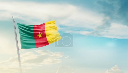 Cameroon waving flag against blue sky with clouds