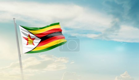Foto de Zimbabue ondeando bandera contra el cielo azul con nubes - Imagen libre de derechos