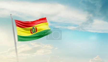 Bolivia waving flag against blue sky with clouds