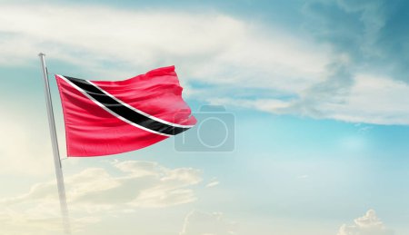 Trinidad and Tobago waving flag against blue sky with clouds