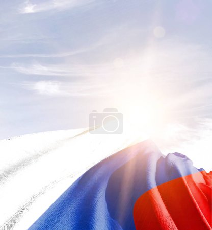 Russia waving flag against blue sky with clouds